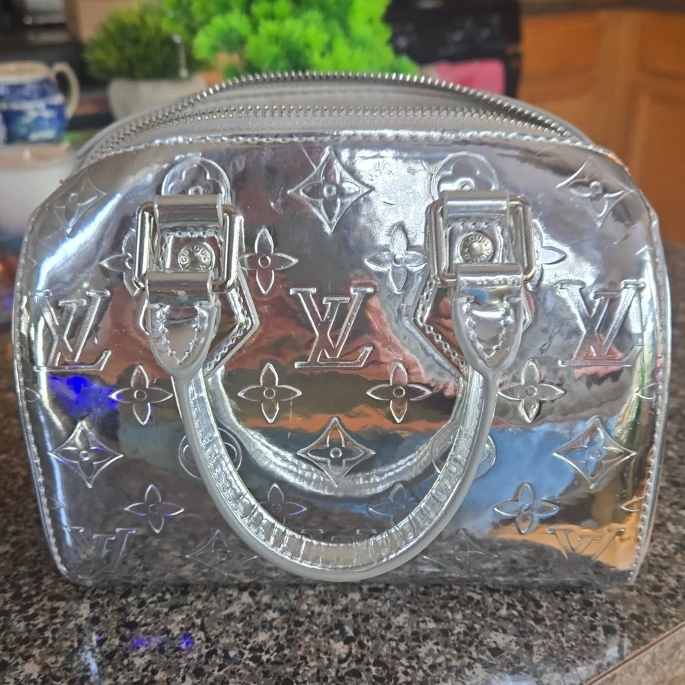 Louis Vuitton Shiny Silver Clutch - Picture 1 of 6